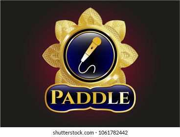    Golden emblem or badge with microphone icon and Paddle text inside