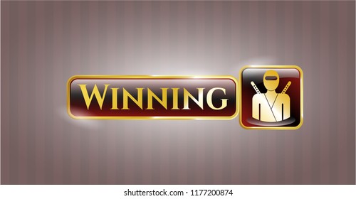  Golden emblem or badge with ninja icon and Winning text inside