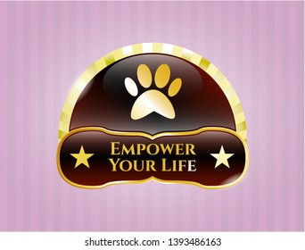  Golden emblem or badge with paw icon and Empower Your Life text inside