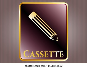  Golden emblem or badge with pencil icon and Cassette text inside