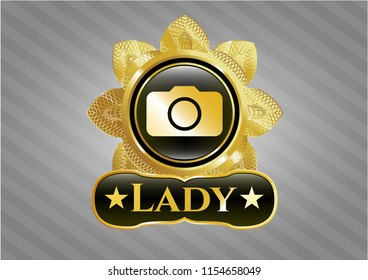  Golden emblem or badge with photo camera icon and Lady text inside
