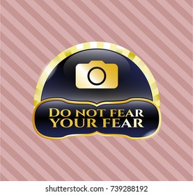  Golden emblem or badge with photo camera icon and Do not fear your fear text inside