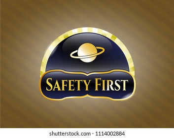   Golden emblem or badge with planet, saturn icon and Safety First text inside