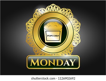  Golden emblem or badge with popcorn icon and Monday text inside