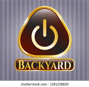  Golden emblem or badge with power icon and Backyard text inside
