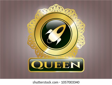  Golden emblem or badge with rocket icon and Queen text inside