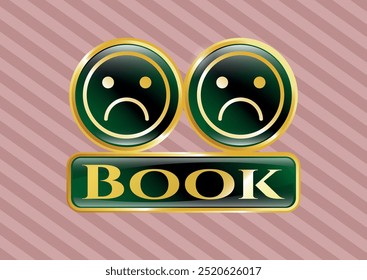 Golden emblem or badge with sad face icon and Book text inside