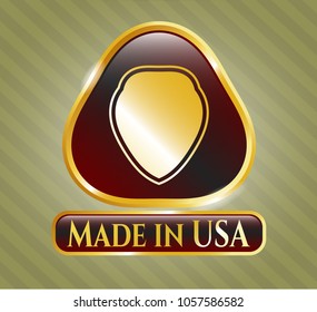  Golden emblem or badge with shield icon and Made in USA text inside