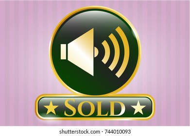  Golden emblem or badge with sound icon and Sold text inside