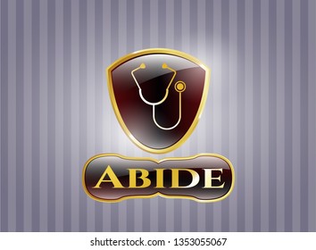  Golden emblem or badge with stethoscope icon and Abide text inside