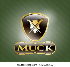  Golden emblem or badge with swords crossed with shield icon and Muck text inside