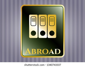  Golden emblem or badge with three folders icon and Abroad text inside