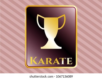  Golden emblem or badge with trophy icon and Karate text inside