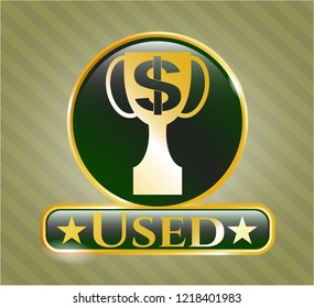 Golden emblem or badge with trophy with money symbol inside icon and Used text inside