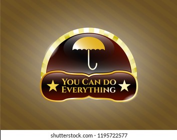  Golden emblem or badge with umbrella icon and You Can do Everything text inside
