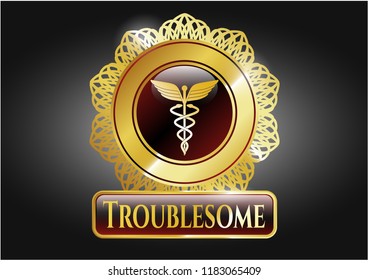  Golden emblem with Caduceus medical icon and Troublesome text inside