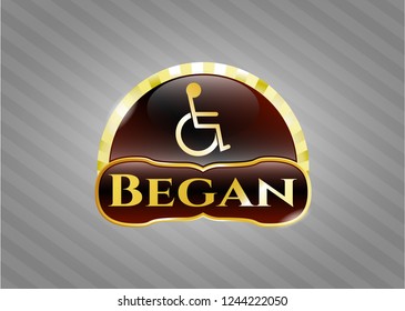  Golden emblem with disabled (wheelchair) icon and Began text inside