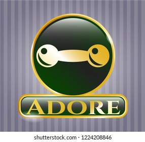  Golden emblem with dumbbell icon and Adore text inside