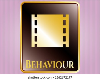  Golden emblem with film icon and Behaviour text inside