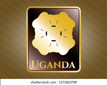  Golden emblem with four leaf clover icon and Uganda text inside