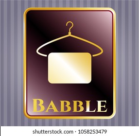  Golden emblem with hanger with towel icon and Babble text inside