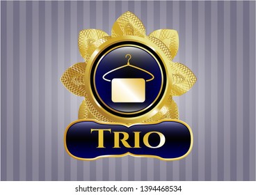  Golden emblem with hanger with towel icon and Trio text inside