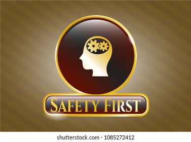  Golden emblem with head with gears inside icon and Safety First text inside