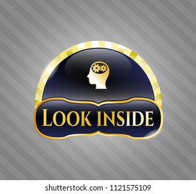  Golden emblem with head with gears inside icon and Look inside text inside