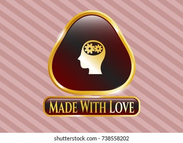  Golden emblem with head with gears inside icon and Made With Love text inside