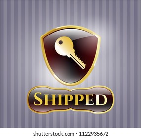  Golden emblem with key icon and Shipped text inside