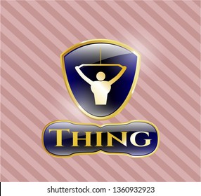  Golden emblem with lat pull down, exercise icon and Thing text inside