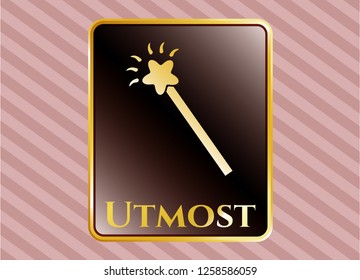  Golden emblem with magic stick icon and Utmost text inside