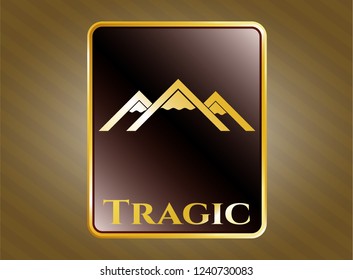  Golden emblem with mountain icon and Tragic text inside