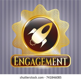  Golden emblem with rocket icon and Engagement text inside