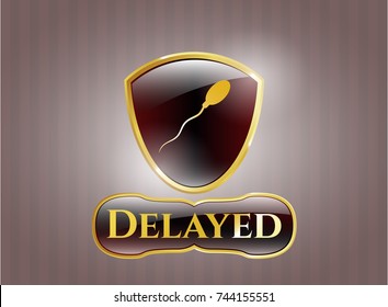  Golden emblem with sperm icon and Delayed text inside