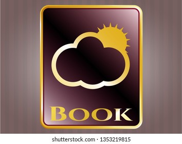  Golden emblem with sun behind cloud icon and Book text inside