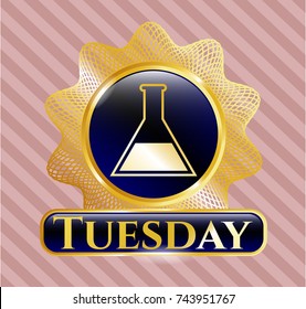  Golden emblem with test tube icon and Tuesday text inside