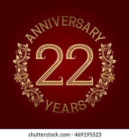 Golden emblem of twenty second anniversary. Celebration patterned sign on red.