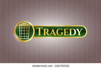  Golden emblem with wastepaper basket icon and Tragedy text inside