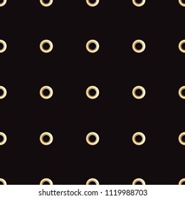 Golden eyelet seamless pattern isolated on black background. Metal polka dot with hole imitation. Vector repaet wallpaper with gold rings, fashion textile print, abstract geometric backdrop.