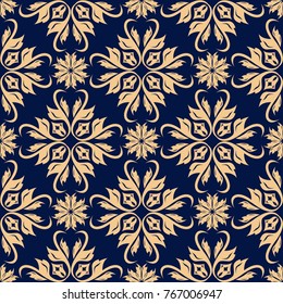 Golden floral design on dark blue background. Seamless pattern for textile and wallpapers
