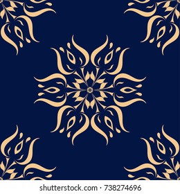Golden floral element on dark blue background. Seamless pattern for textile and wallpapers
