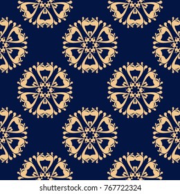 Golden floral element on dark blue background. Seamless pattern for textile and wallpapers