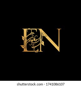 Lettre florale dorée E et N, logo EN Icône, alphabet de luxe police initiale design isolé sur fond noir.