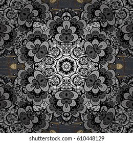 Golden floral ornament in baroque style. Damask repeating background. Golden element on gray background. Antique golden repeatable wallpaper.