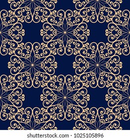 Golden floral ornament on dark blue background. Seamless pattern for textile and wallpapers