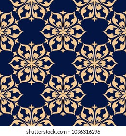 Golden floral ornament on dark blue background. Seamless pattern for textile and wallpapers