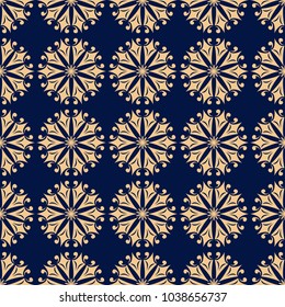 Golden floral ornament on dark blue background. Seamless pattern for textile and wallpapers