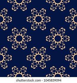Golden floral ornament on dark blue background. Seamless pattern for textile and wallpapers