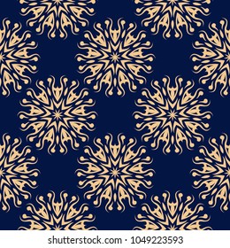 Golden floral ornament on dark blue background. Seamless pattern for textile and wallpapers